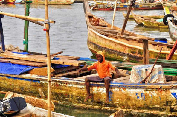 Boy Sitting On A Traditional African Fishing Boat. Image credit: Getty images